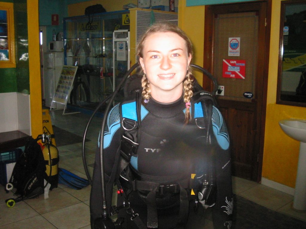 A woman wearing scuba diving gear