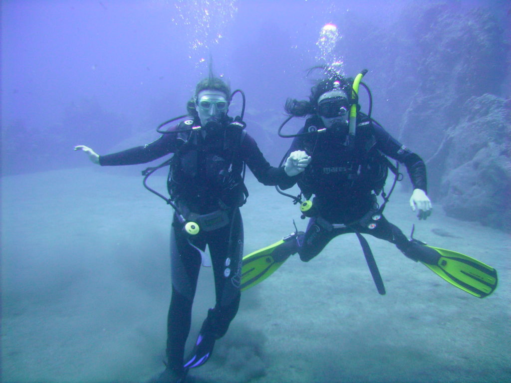 A scuba diving couple underwater