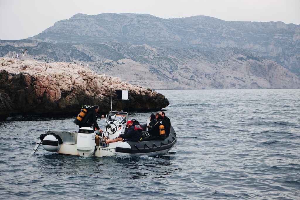 Scuba divers on a boat from a dive centre