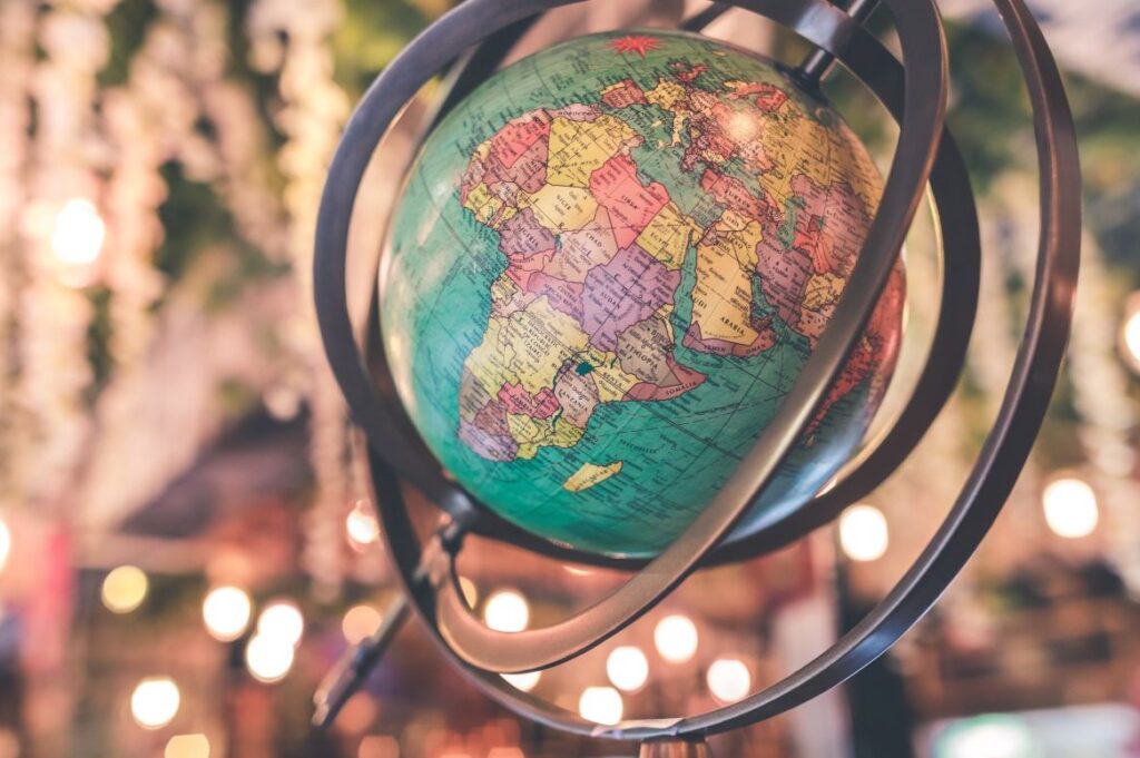 a globe spinning aurrounded by fairy lights